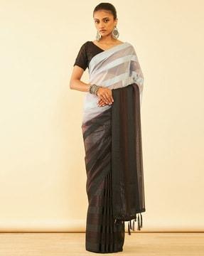 women striped saree with tassels