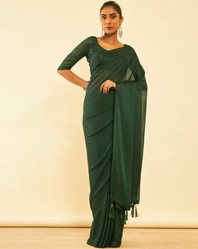 women striped saree with tassels