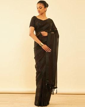 women striped saree with tassels