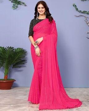 women striped saree with tassels