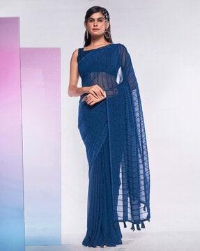 women striped saree with tassels