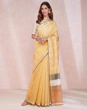 women striped saree with tassels