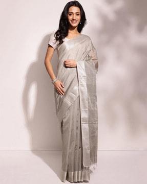 women striped saree with tassels