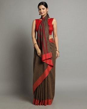 women striped saree with tassels