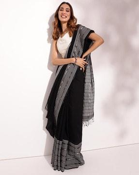 women striped saree with tassels