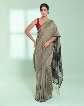 women striped saree with tassels