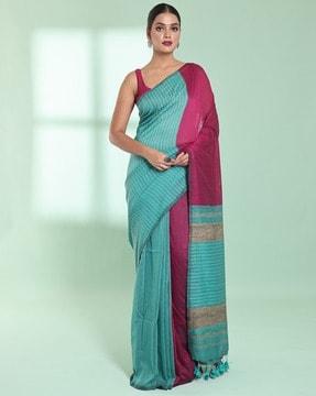 women striped saree with tassels