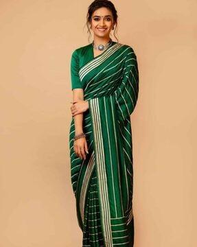 women striped saree with zari border