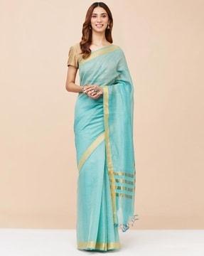 women striped silk saree with tassels