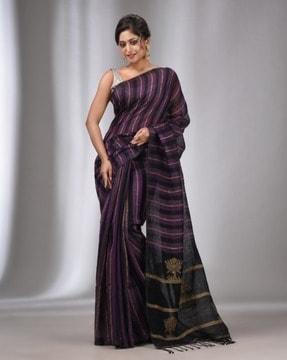 women striped woven saree with tassels