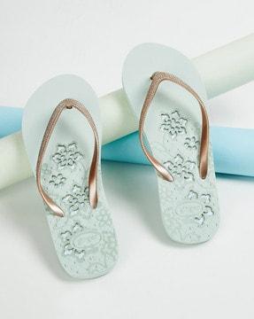 women thong-strap flip-flops with floral print footbed