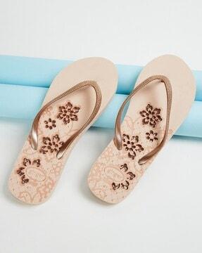 women thong-strap flip-flops with floral print footbed