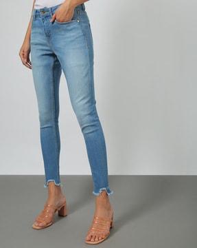 women washed frayed hems skinny jeans