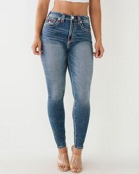 women washed skinny jeans