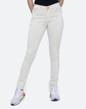 women washed skinny jeans
