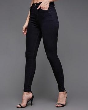 women washed skinny jeans