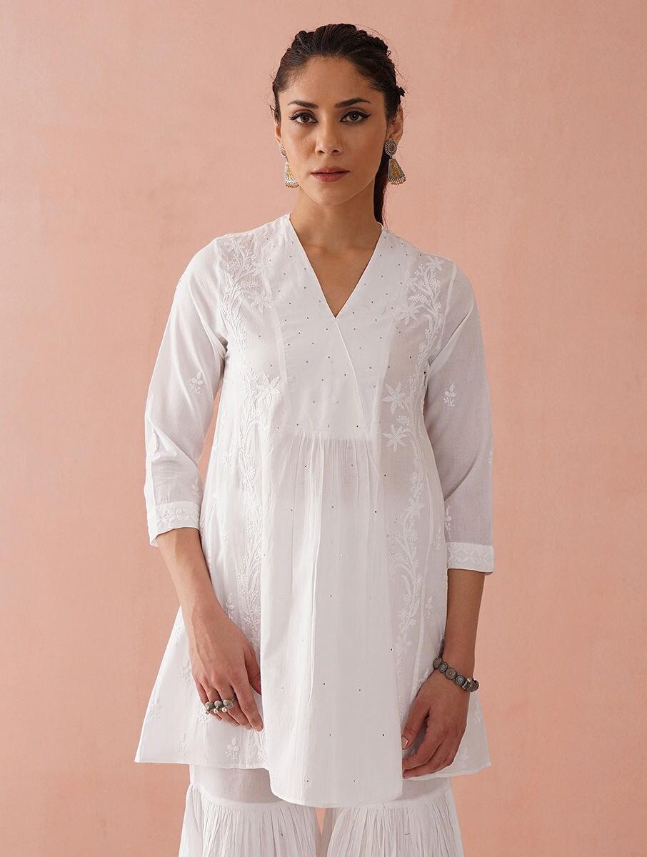 women white cotton embroidered v neck regular fit tunics