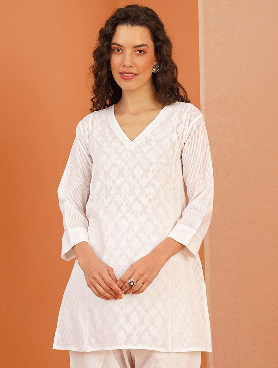 women white cotton self design v neck regular fit tunics