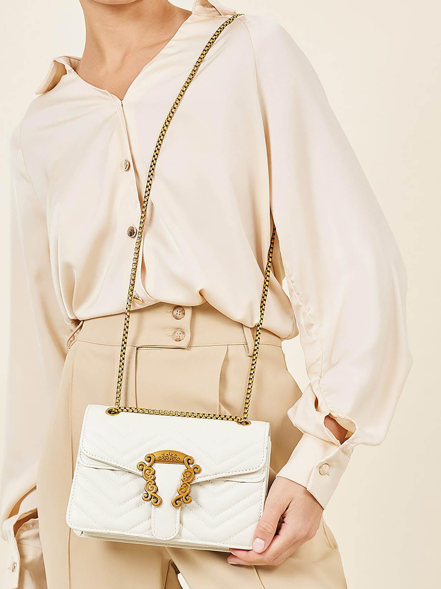 women white push lock snake print sling bag