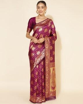 women woven saree with contrast border & tassels