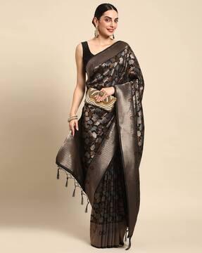 women woven saree with tasselled border