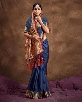 women woven saree with tassels