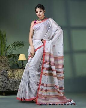 women woven saree with tassels