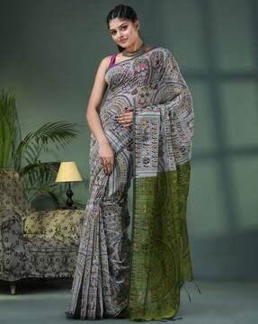 women woven saree with tassels