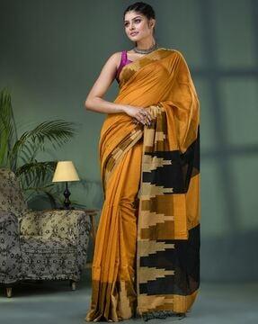 women woven saree with tassels