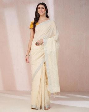 women woven saree with tassels