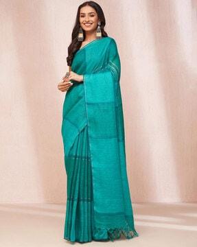 women woven saree with tassels