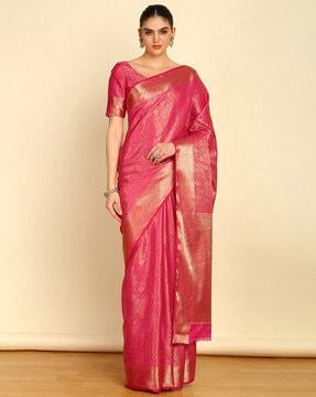 women woven saree with zari border