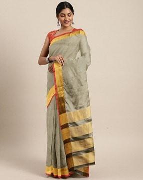 women woven saree with zari border