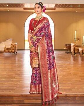 women woven zari saree with tassels