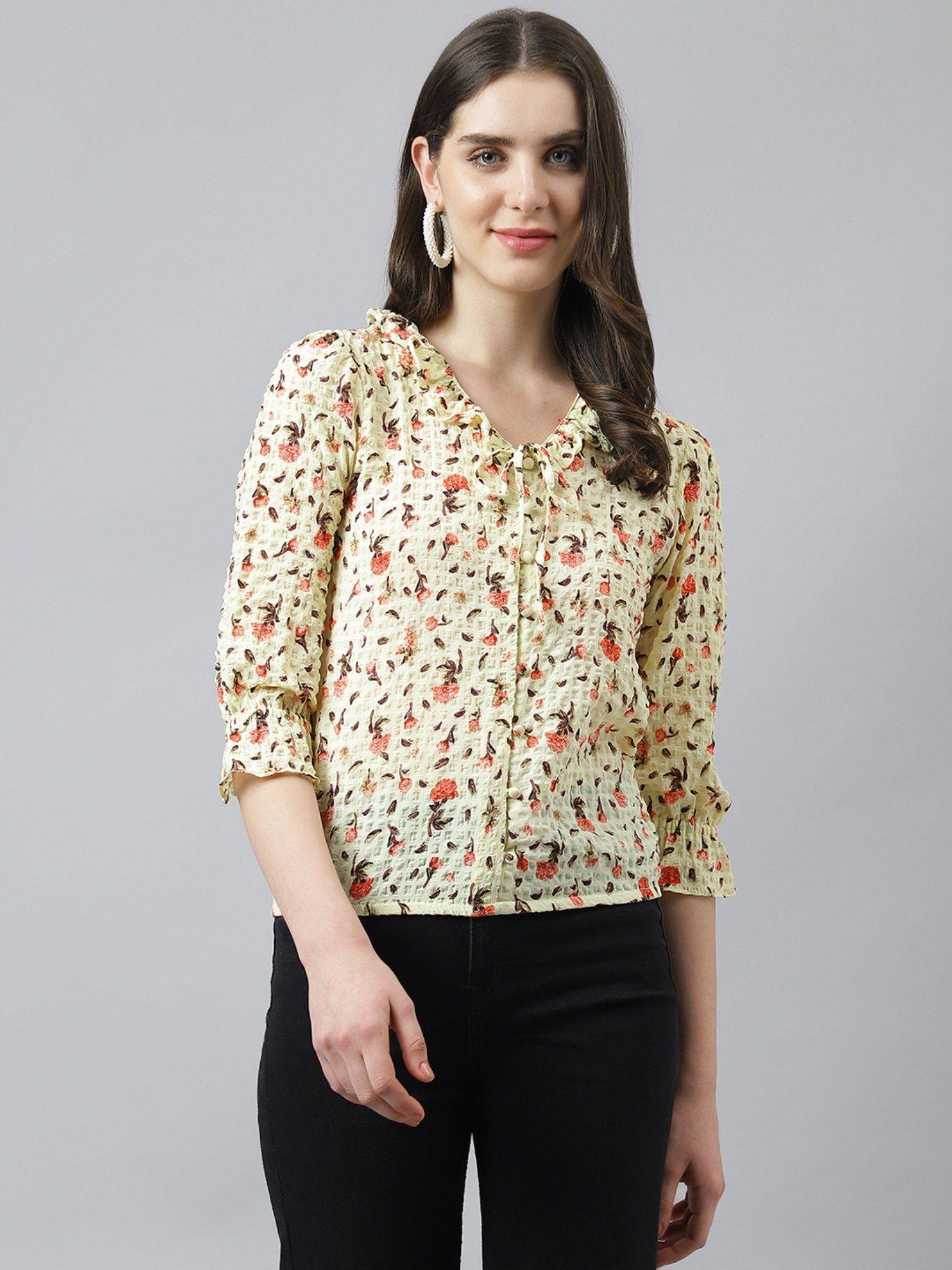 women yellow printed top with ruffles