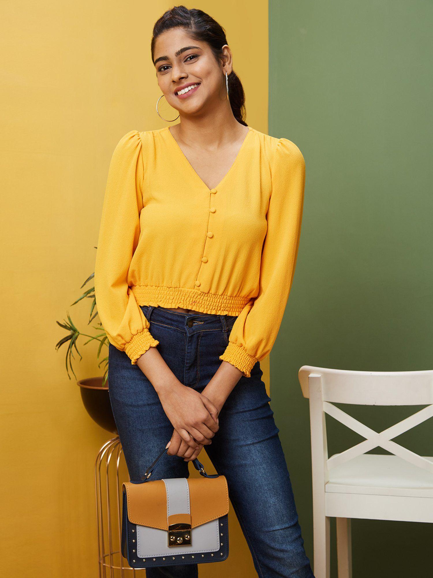 women yellow solid casual v-neck top