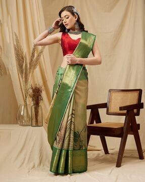 women zari woven saree with tassels