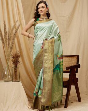 women zari woven saree with tassels