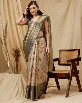 women zari woven saree with tassels