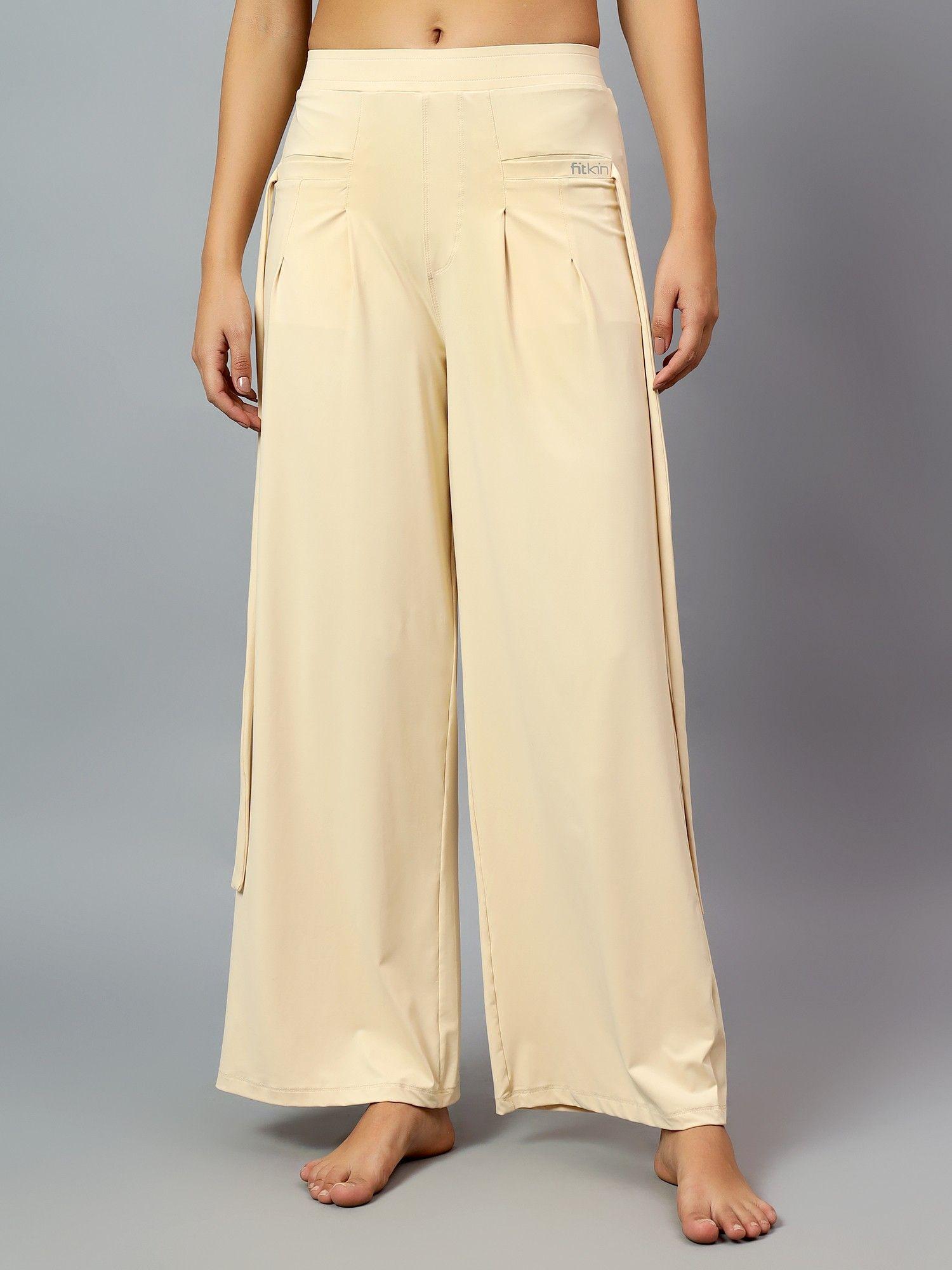 womens cream relaxed fit pleated bootcut trackpant