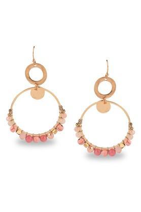 womens gold ring shaped earrings embellished with pink beads