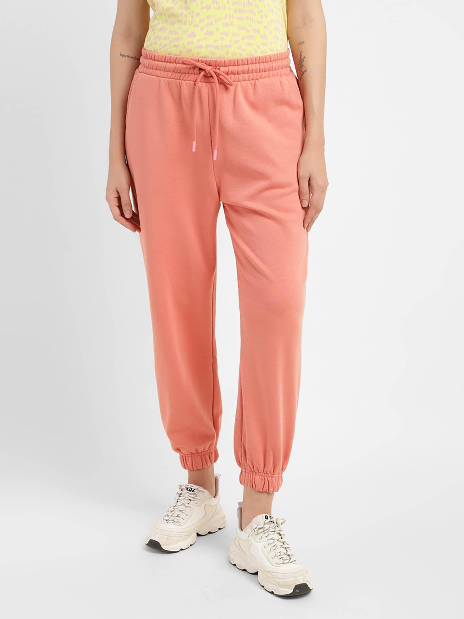 womens mid rise pink loose tapered fit trousers