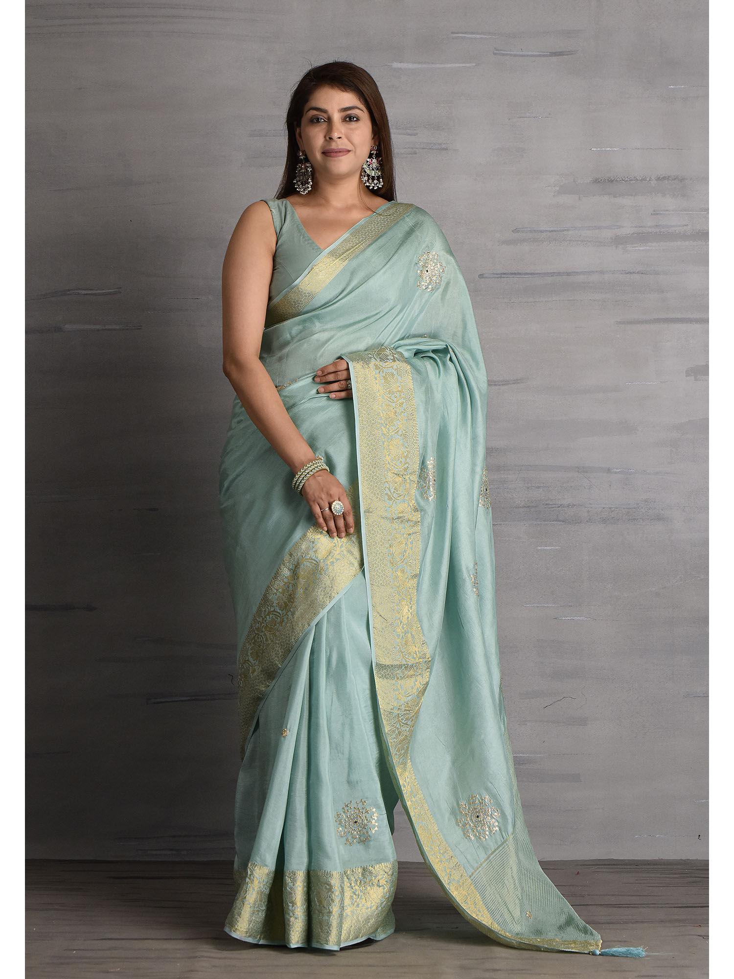 womens powder blue hand embellished zari border silk saree with unstitched blouse