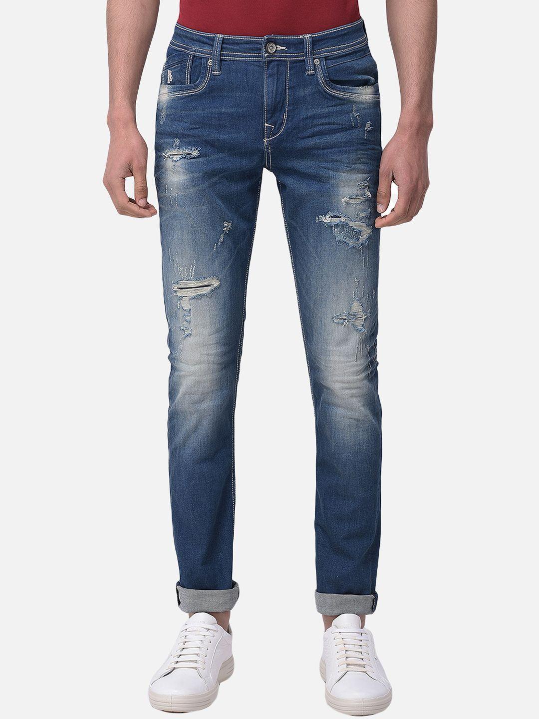 woodland men blue slim fit highly distressed heavy fade stretchable jeans