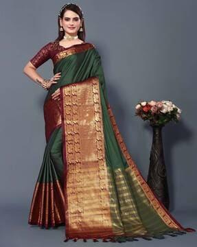 woven banarasi aura silk saree with tassels