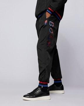 x nba track pants with colourful branding