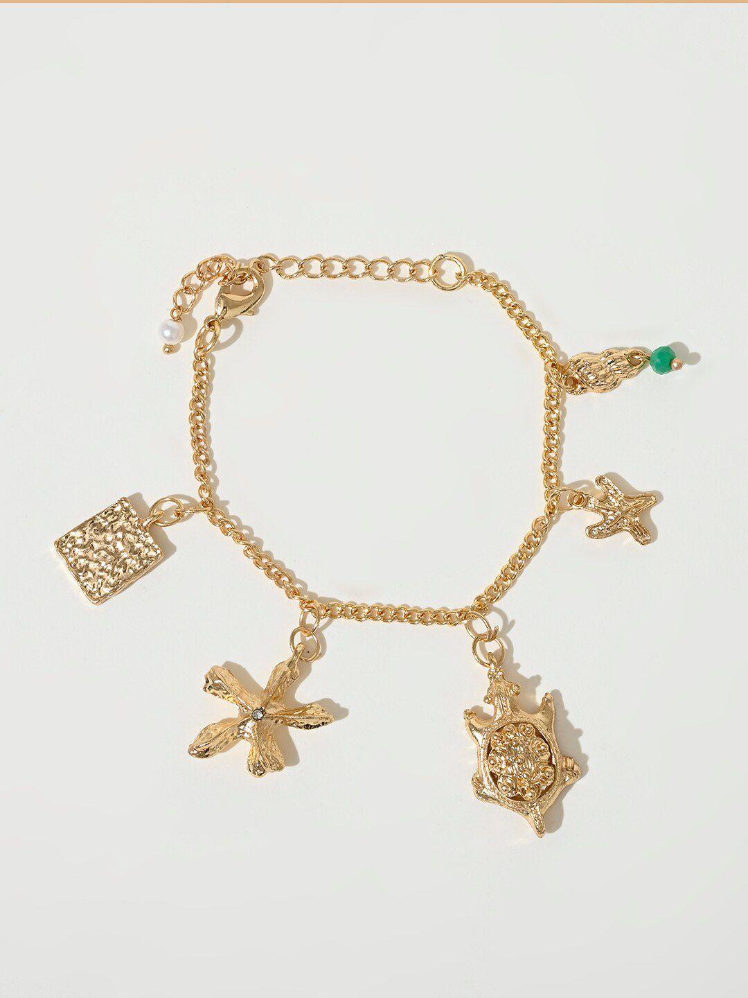 xpnsv gold-toned charm bracelet