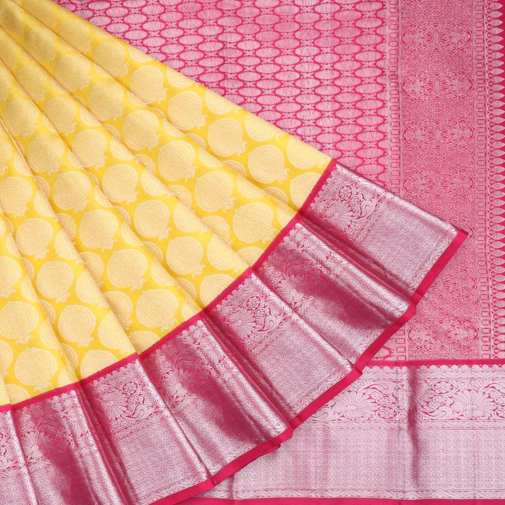 yellow kanjivaram silk saree with floral buttas