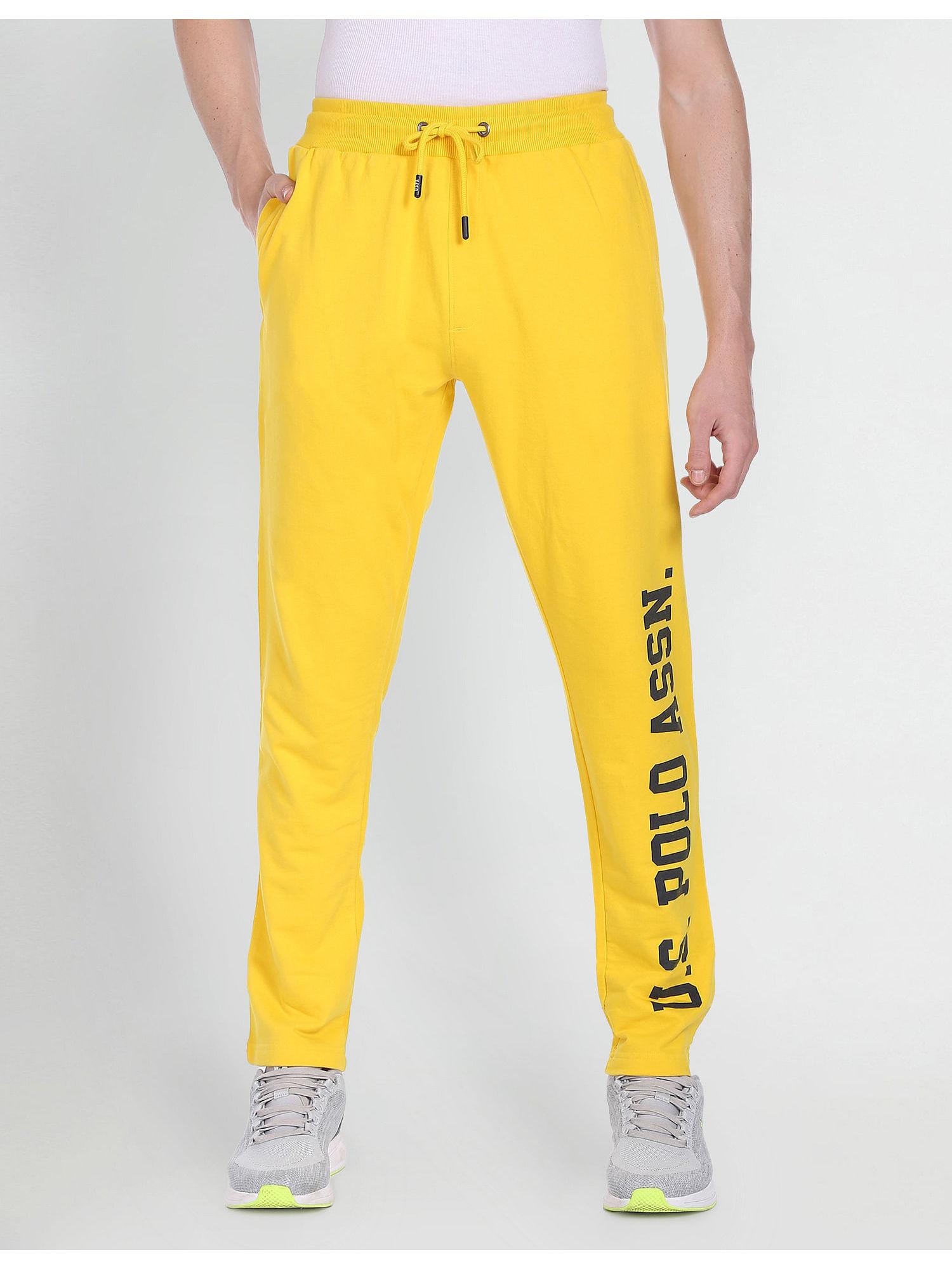 yellow brand print drawstring waist track pants
