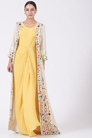 yellow dress with embroidered cape